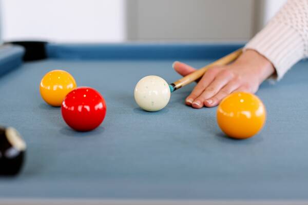 Student using a pool table