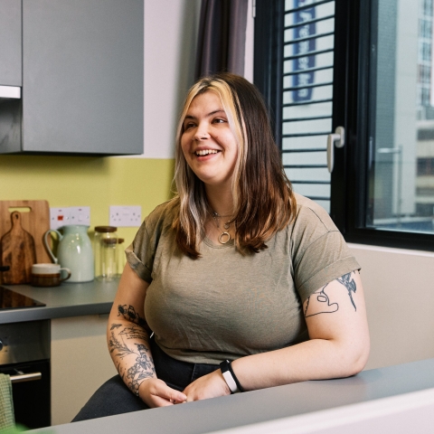 A student in a kitchen in halls
