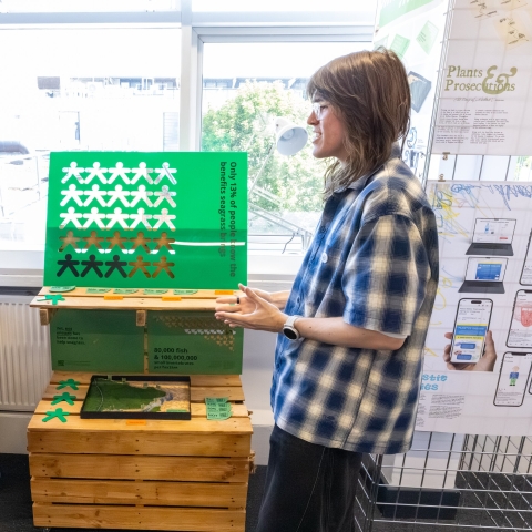 Two students discuss their work