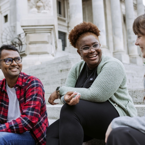 Three people laughing and talking 