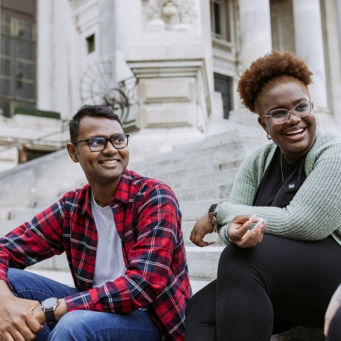Three people laughing and talking 