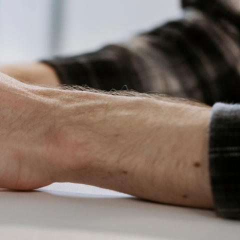 hands typing at a keyboard