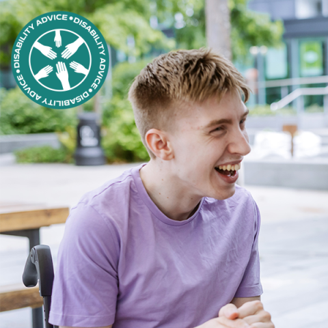 Disability Advice teaser image showing a student smiling and sitting in a wheelchair