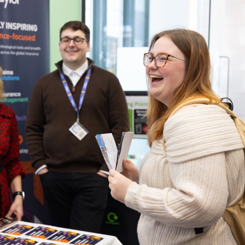 Student at a careers fair interacting with employers