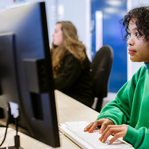 Woman browsing University of Portsmouth website