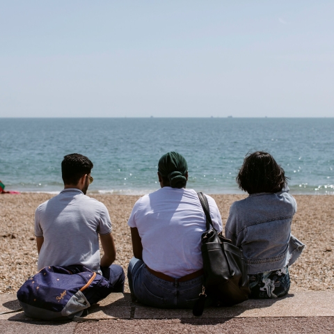  Students sat on southsea beach staring out to see