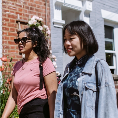 Two students walking past houses to rent in Portsmouth 