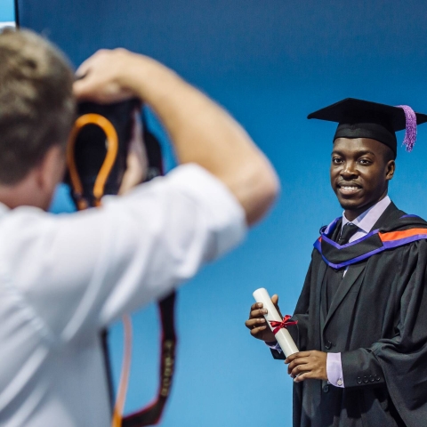 Photographer taking graduation photos