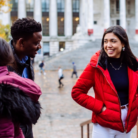 two female students walking and talking together