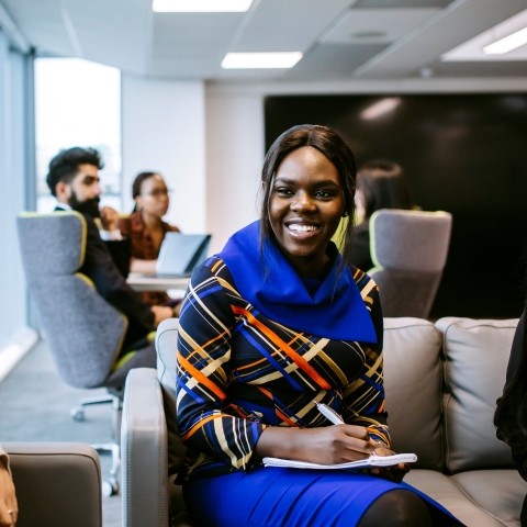 Smiling student in library in placements meeting