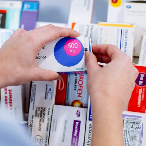 Close up of nursing student handling pharmaceuticals