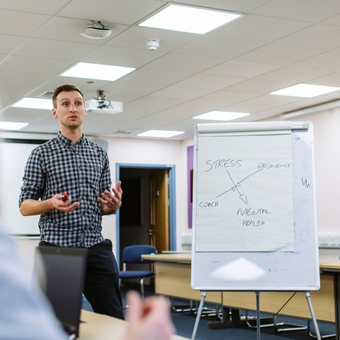  A lecturer standing and teaching