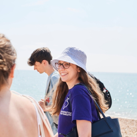Students walking along the beach at Southsea in summer