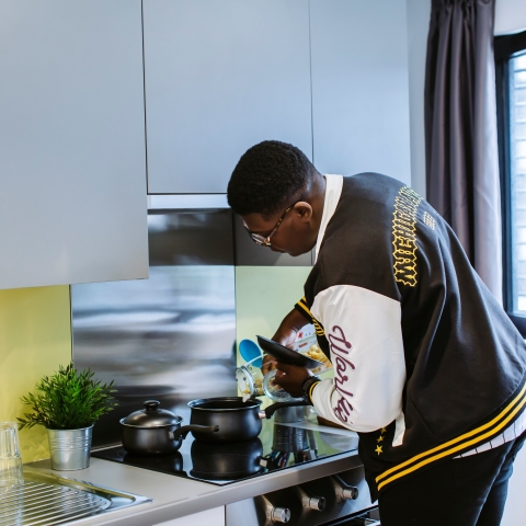 Student cooking in halls