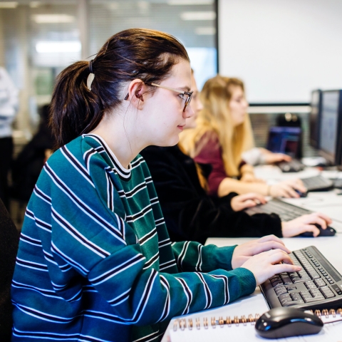 Female University of Portsmouth student working in computer lab