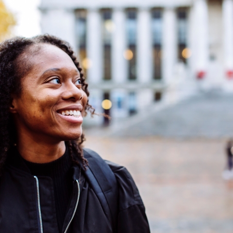 Smiling international student outside the Guildhall
