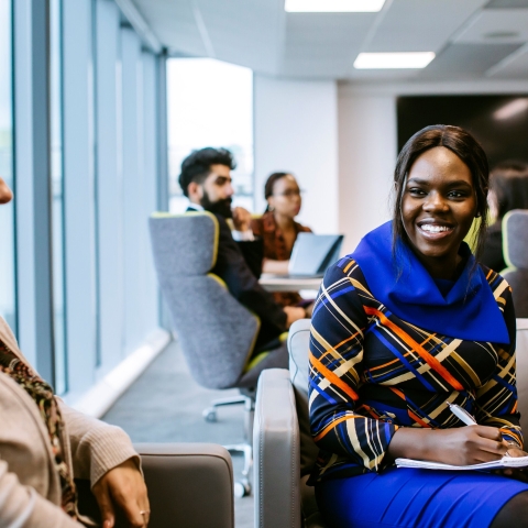 Smiling student in library in placements meeting