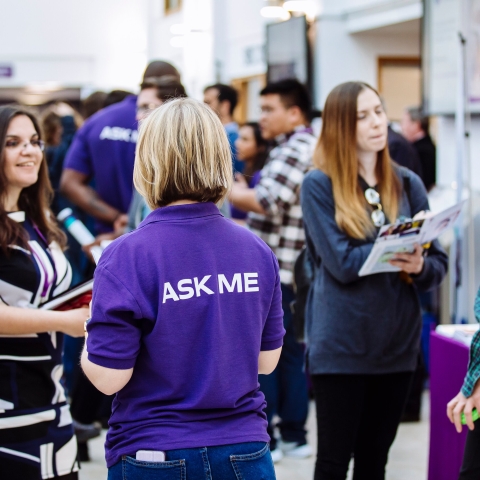 Postgraduate students and staff at an open evening
