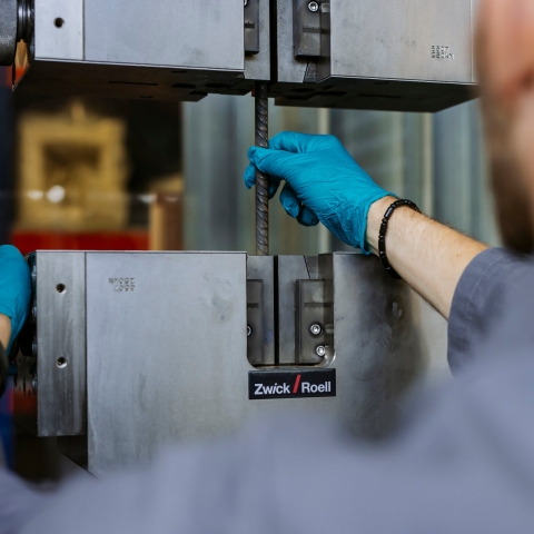 Student examines drill bit at Technology Facilities