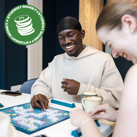 Student Money teaser image showing two students playing a board game