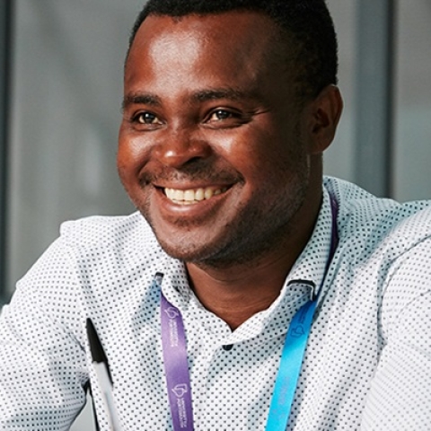 Student smiling with notebook