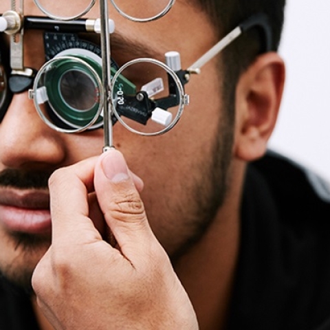 Patient having an eye test wearing a trial frame