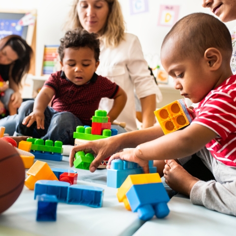 Children playing with toy bricks