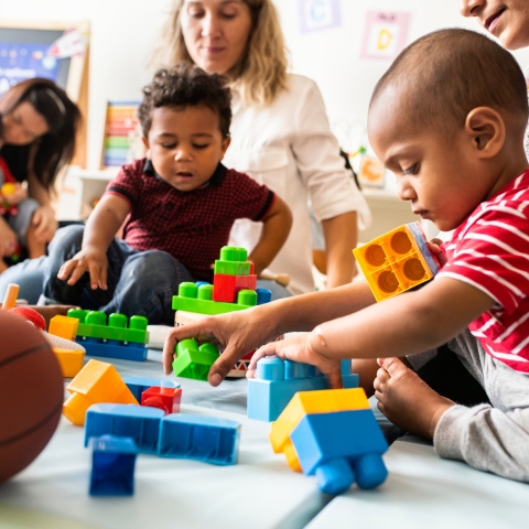 Children playing with toy bricks