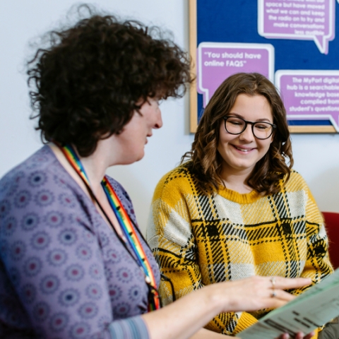 University Student Finance staff advising a student