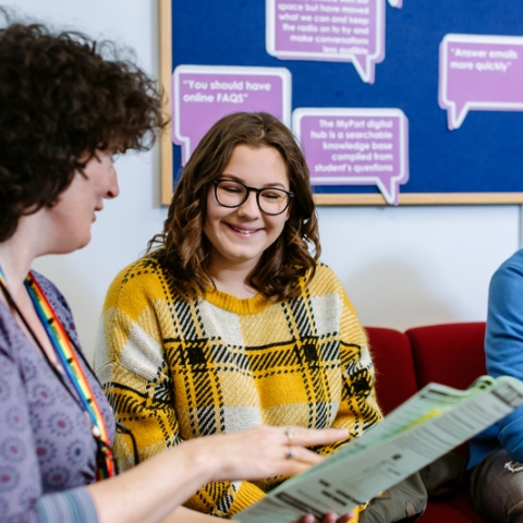 University Student Finance staff advising a student