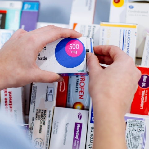 Close up of nursing student handling pharmaceuticals