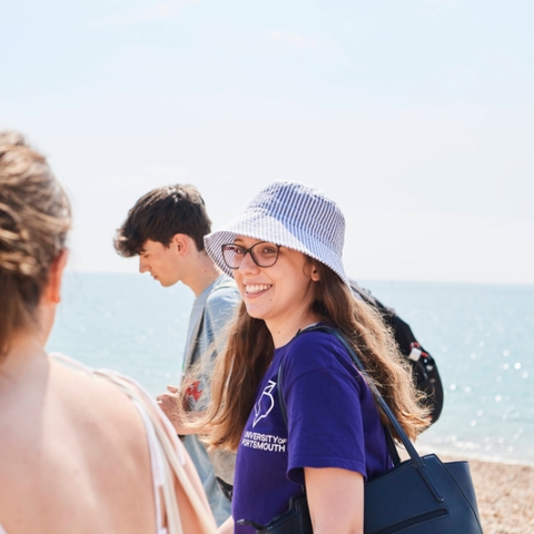 Students walking along the beach at Southsea in summer