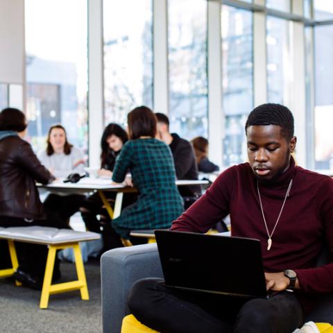 Students working on written projects in Eldon building