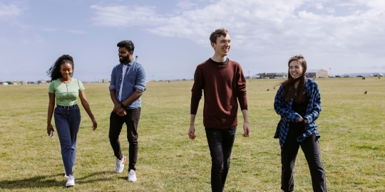 A group of sudents hanging out on the common