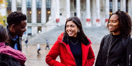 two female students walking and talking together