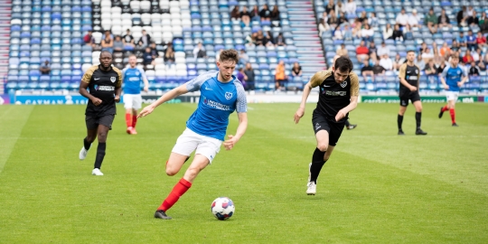Staff vs students playing football at Fratton Park