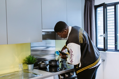 Student cooking in halls