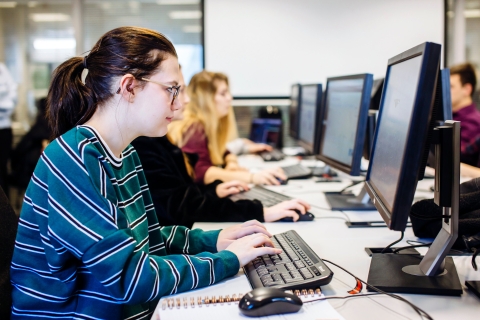 Female University of Portsmouth student working in computer lab