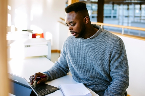 Male student on laptop