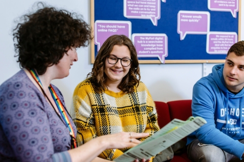 University Student Finance staff advising a student