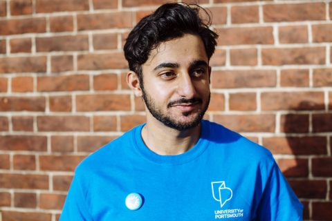 Male ambassador in a blue shirt