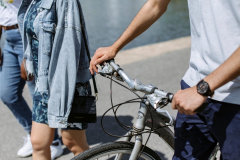 Student pushing a bicycle