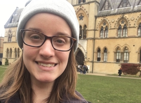 International student Sophie standing in front of a church