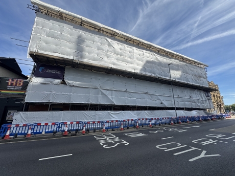 Building surrounded by scaffolding