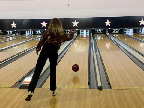 image of the back of a student at a bowling alley