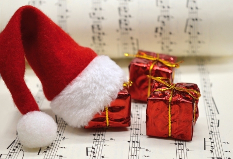Santa hat on top of carol sheet