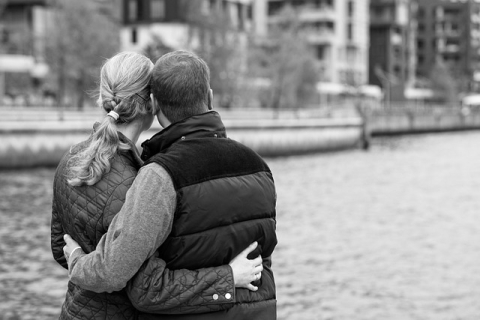 couple embracing near a river