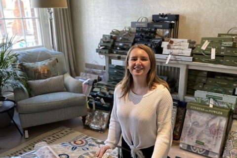 Rebecca Walford smiling in Anne Haimes Interiors