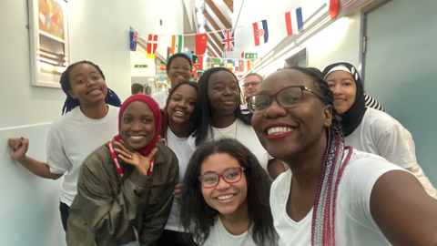 Five members of the afro fusion society looking at the camera