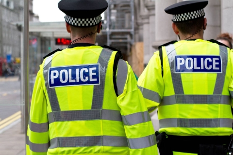 Two policemen patrolling in the street